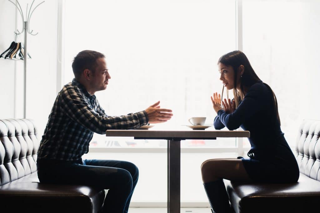 Scene in cafe - couple conflict arguing during the lunch.